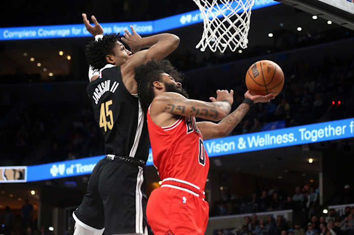 Chicago Bulls guard Coby White (0) shoots as Memphis Grizzlies forward GG Jackson (45) defends during the second half at FedExForum.